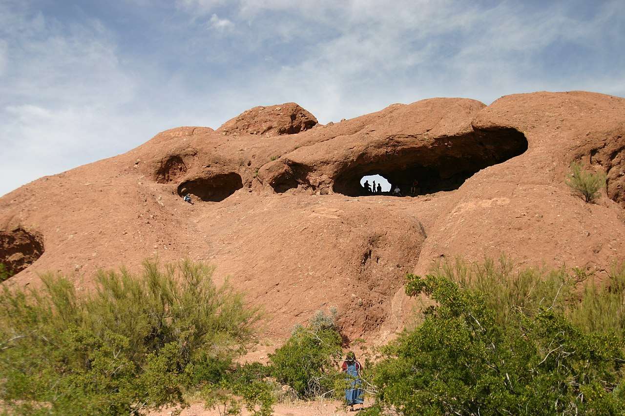 Hole-in-the-Rock in Papago Park, prominent red sandstone cavities were carved by millions of years of wind and water erosion.