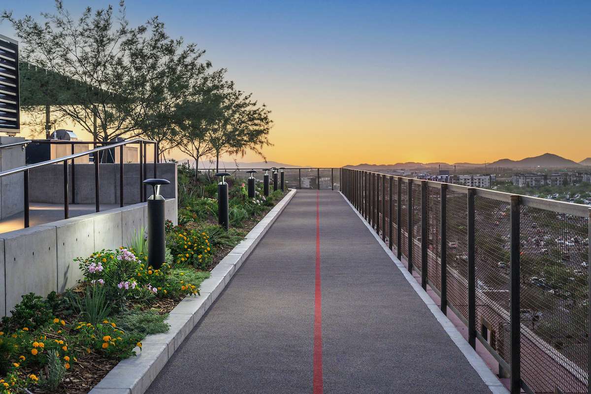 Rooftop amenity deck with a jogging track at the Optima McDowell Mountain luxury residences in North Scottsdale, Arizona.