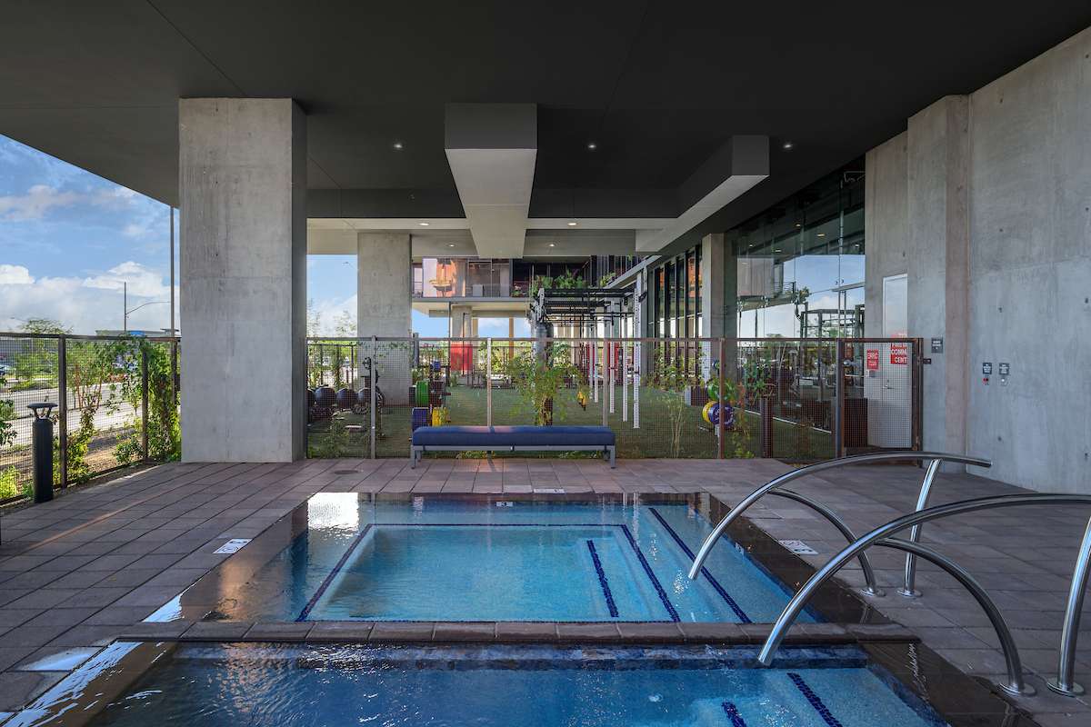 The outdoor spa & hydrotherapy deck at the Optima Kierland luxury apartments, turfed strength training area in background.