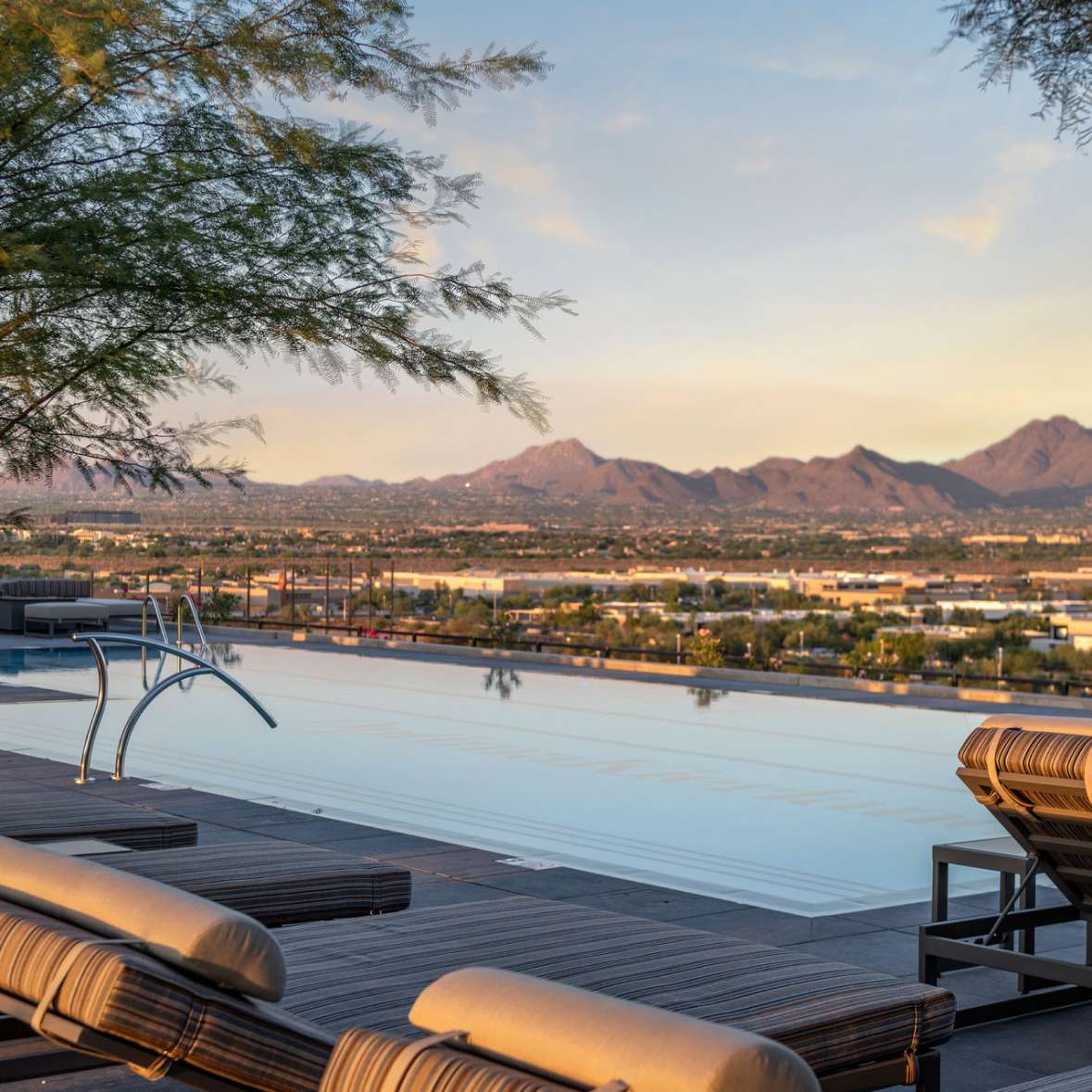Lap pool at the luxury homes at Optima McDowell Mountain in North Scottsdale with views of the city and nearby mountains.