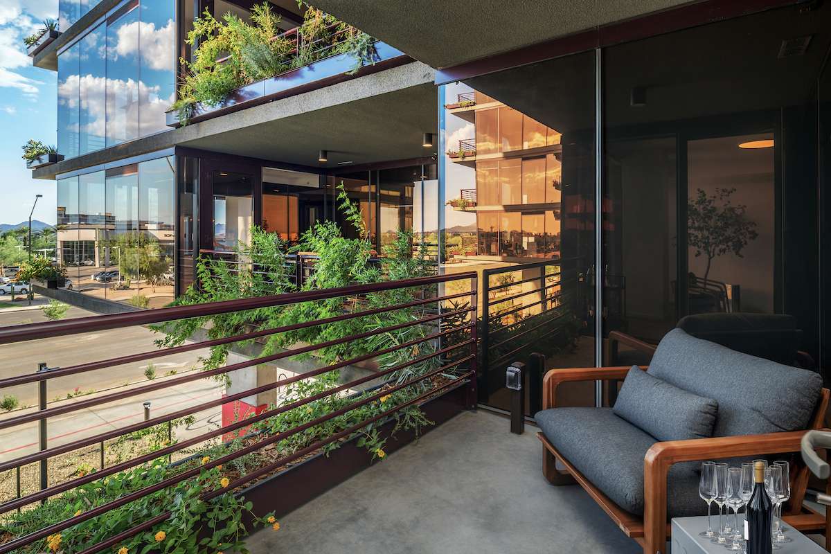 A private terrace at Optima McDowell Mountain residences in Scottsdale, with vertical landscaping that runs down the facade.