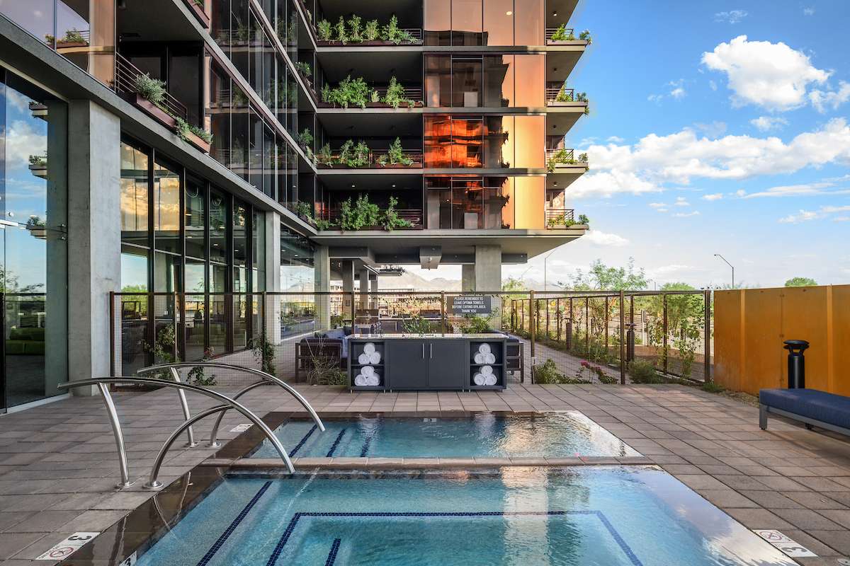 Rooftop hot tub at the Optima McDowell Mountain apartments in Scottsdale, Arizona, with its signature vertical garden design.