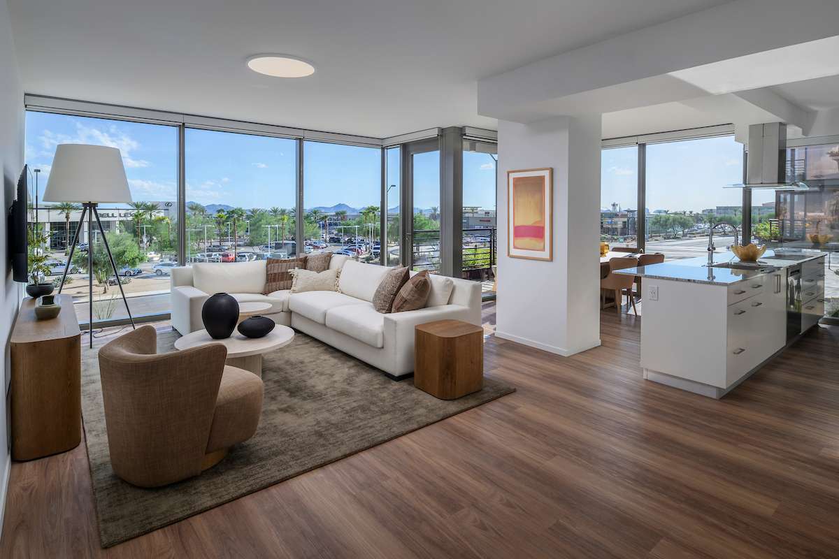 A unit within the Optima McDowell Mountain apartments in Scottsdale, featuring floor-to-ceiling windows and modern finishes.