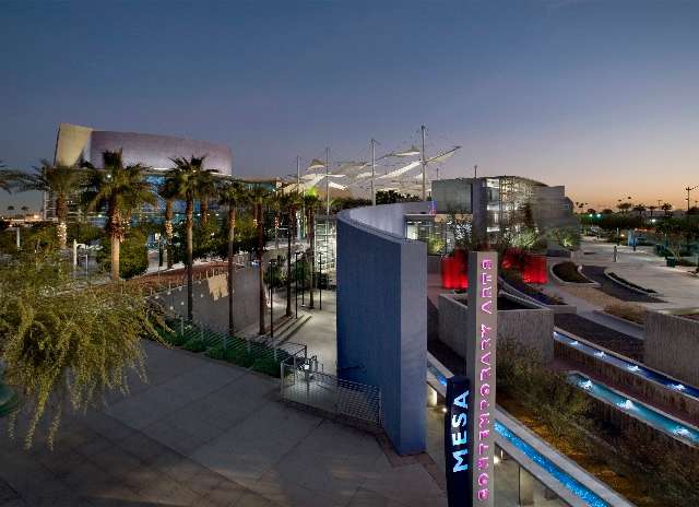 The palm tree-lined entrance to the Mesa Arts Center in Arizona, modernist architecture designed by Bora Architects.